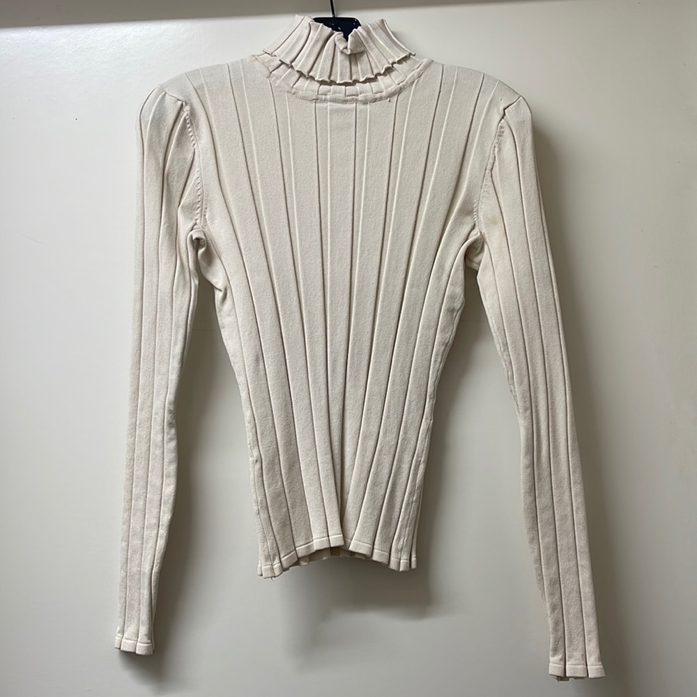 Cream ribbed turtleneck. Super soft and in like new condition.